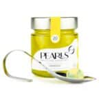 Frasco de esferificaciones de Limoncello Pearls con la cucharilla de servicio y una Pearl, sobre fondo blanco